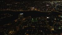 5K stock footage aerial video Pan across downtown and Lake Merritt, Downtown Oakland, California, night Aerial Stock Footage | DCSF06_095