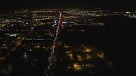 5K stock footage aerial video Follow Interstate 880 and approach O.co Coliseum, Oracle Arena, Oakland, California, night Aerial Stock Footage | DCSF06_099
