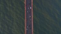 5K stock footage aerial video Bird's eye view of cars on the Golden Gate Bridge, San Francisco, California, sunset Aerial Stock Footage | DCSF07_041