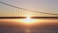 5K stock footage aerial video Flying by the south end of the Golden Gate Bridge, San Francisco, California, sunset Aerial Stock Footage | DCSF07_050