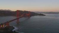 5K stock footage aerial video Flying by the Golden Gate Bridge, Marin Headlands in the background, San Francisco, California, sunset Aerial Stock Footage | DCSF07_052
