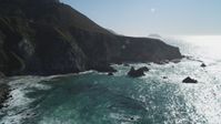 5K Aerial Video Flying by waves crashing into the base of coastal cliffs, Big Sur, California Aerial Stock Footage | DCSF11_023