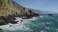 5K Aerial Video Flying over waves crashing into rocks at the base of cliffs, Big Sur, California Aerial Stock Footage | DCSF11_032