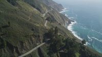 5K Aerial Video Tilt up Highway 1 with light traffic above coastal cliffs, Big Sur, California Aerial Stock Footage | DCSF11_034