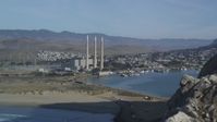 5K stock footage aerial video of flyby Morro Rock, reveal Dynegy Power Plant and smoke stacks, Morro Bay, California Aerial Stock Footage | DFKSF03_003