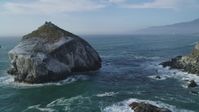 5K stock footage aerial video approach and flyby a large rock formation off the coast, Big Sur, California Aerial Stock Footage | DFKSF03_094