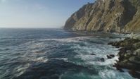 5K stock footage aerial video of flying low over the ocean past coastal cliffs, Big Sur, California Aerial Stock Footage | DFKSF03_125