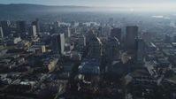 5K stock footage aerial video reverse view of federal building and city buildings, Downtown Oakland, California Aerial Stock Footage | DFKSF05_008