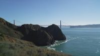 5K stock footage aerial video of flying over Marin Headlands revealing Golden Gate Bridge, San Francisco, California Aerial Stock Footage | DFKSF05_047