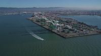 5K stock footage aerial video approach large cargo cranes at the Port of Oakland, California Aerial Stock Footage | DFKSF05_092