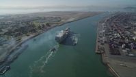 5K stock footage aerial video of tracking a cargo ship by the Port of Oakland, California Aerial Stock Footage | DFKSF09_018
