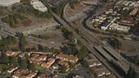 5K stock footage aerial video of a reverse view of the I-280 freeway interchange and tract homes, San Jose, California Aerial Stock Footage | DFKSF12_009