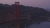 5K stock footage aerial video of a reverse view of traffic on the Marin side of the Golden Gate Bridge, San Francisco, California, twilight Aerial Stock Footage | DFKSF14_037