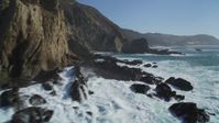 5K stock footage aerial video of flying around coastal cliffs and rock formations, Big Sur, California Aerial Stock Footage | DFKSF16_077