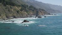 5K stock footage aerial video of flying low by steep coastal cliffs and rock formations, Big Sur, California Aerial Stock Footage | DFKSF16_127