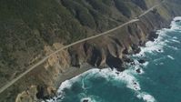 5K stock footage aerial video tilt Highway 1 coastal road, small beach and coastal cliffs, Big Sur, California Aerial Stock Footage | DFKSF16_131