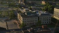 5.7K stock footage aerial video of circling around a federal courthouse at sunset in East St. Louis, Illinois Aerial Stock Footage | DX0001_000690