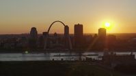 5.7K stock footage aerial video of the Gateway Arch and Downtown St. Louis, Missouri skyline with the setting sun in the background Aerial Stock Footage | DX0001_000715