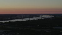 5.7K stock footage aerial video of the Stan Musial Veterans Memorial Bridge and Mississippi River at sunset in St. Louis, Missouri Aerial Stock Footage | DX0001_000727