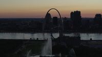 5.7K stock footage aerial video ascend over the Gateway Geyser for view of the Arch in Downtown St. Louis, Missouri, twilight Aerial Stock Footage | DX0001_000758