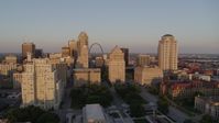 5.7K stock footage aerial video of a static view of courthouses, the Gateway Arch and city hall at sunset, Downtown St. Louis, Missouri Aerial Stock Footage | DX0001_000854