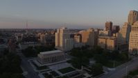 5.7K stock footage aerial video fly over museum to approach a tall apartment building at sunset, Downtown St. Louis, Missouri Aerial Stock Footage | DX0001_000858