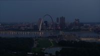 5.7K stock footage aerial video of the Gateway Arch at twilight, visible from across the Mississippi River, Downtown St. Louis, Missouri Aerial Stock Footage | DX0001_000895