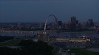 5.7K stock footage aerial video of the famous Gateway Arch at twilight, visible from across the Mississippi River, Downtown St. Louis, Missouri Aerial Stock Footage | DX0001_000896