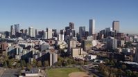 5.7K stock footage aerial video of flyby the city's skyline descend behind office buildings, Downtown Denver, Colorado Aerial Stock Footage | DX0001_001677