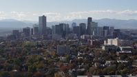 5.7K stock footage aerial video of flying by the city's skyline with Rockies in the background, Downtown Denver, Colorado Aerial Stock Footage | DX0001_001754