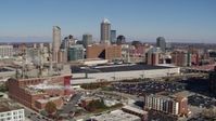 5.7K stock footage aerial video reverse view of brick factory, convention center and city skyline, Downtown Indianapolis, Indiana Aerial Stock Footage | DX0001_002810
