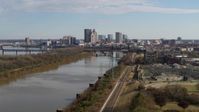 5.7K stock footage aerial video ascend over river with view of the city's skyline in Downtown Louisville, Kentucky Aerial Stock Footage | DX0001_002996