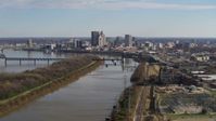5.7K stock footage aerial video of the city's skyline seen while flying by the river in Downtown Louisville, Kentucky Aerial Stock Footage | DX0001_002999