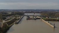 5.7K stock footage aerial video approach locks and a dam on the Ohio River before ascent in Louisville, Kentucky Aerial Stock Footage | DX0001_003015