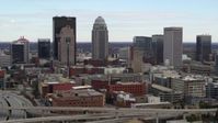 5.7K stock footage aerial video descend near freeway offramp with view of city skyline in Downtown Louisville, Kentucky Aerial Stock Footage | DX0001_003018