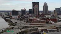 5.7K stock footage aerial video descend near freeway with view of skyscrapers in Downtown Louisville, Kentucky Aerial Stock Footage | DX0001_003023