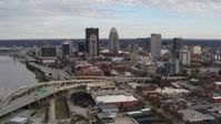 5.7K stock footage aerial video fly away from freeway and past city skyline in Downtown Louisville, Kentucky Aerial Stock Footage | DX0001_003032