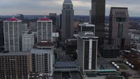 5.7K stock footage aerial video fly over Ohio River to approach skyline and hotel in Downtown Louisville, Kentucky Aerial Stock Footage | DX0001_003049