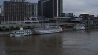 5.7K stock footage aerial video orbit historic riverboat docked by Downtown Louisville, Kentucky Aerial Stock Footage | DX0001_003061