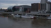 5.7K stock footage aerial video reverse view of historic riverboat docked by Downtown Louisville, Kentucky Aerial Stock Footage | DX0001_003062