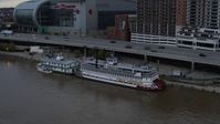 5.7K stock footage aerial video approach the historic riverboat docked by Downtown Louisville, Kentucky Aerial Stock Footage | DX0001_003063