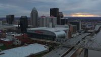 5.7K stock footage aerial video fly away from arena and skyline, reveal bridge and Ohio River at sunset, Downtown Louisville, Kentucky Aerial Stock Footage | DX0001_003069