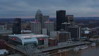 5.7K stock footage aerial video fly away from arena and city skyline at sunset, reveal river, Downtown Louisville, Kentucky Aerial Stock Footage | DX0001_003084