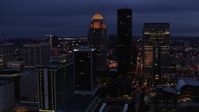 5.7K stock footage aerial video reverse view of a tall skyscraper and skyline lit up at twilight, Downtown Louisville, Kentucky Aerial Stock Footage | DX0001_003107