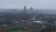 5.7K stock footage aerial video reverse view of the city skyline seen from residential neighborhoods, Downtown Lexington, Kentucky Aerial Stock Footage | DX0001_003207
