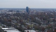 5.7K stock footage aerial video ascend from neighborhood and focus on city skyline, Downtown Lexington, Kentucky Aerial Stock Footage | DX0001_003226