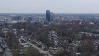 5.7K stock footage aerial video of city skyline while passing by neighborhoods, Downtown Lexington, Kentucky Aerial Stock Footage | DX0001_003229