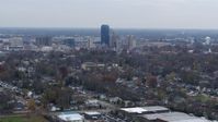 5.7K stock footage aerial video of city skyline while flying by houses, Downtown Lexington, Kentucky Aerial Stock Footage | DX0001_003230