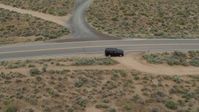 5.7K stock footage aerial video track a black SUV as it turns and drives in the opposite direction in Carson City, Nevada Aerial Stock Footage | DX0001_007_023