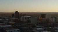 5.7K stock footage aerial video of high-rise office buildings at sunset during ascent in Downtown Albuquerque, New Mexico Aerial Stock Footage | DX0002_122_031